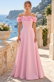Elegant pink off-shoulder A-line prom dress featuring stunning 3D flower embellishments and luxurious satin fabric. The romantic silhouette drapes beautifully from the shoulders, creating a flattering, feminine look perfect for formal occasions.