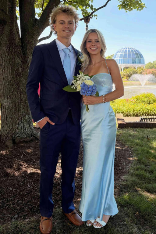 Elegant and sophisticated, this sleeveless formal dress features a stunning blue satin construction with graceful pleats throughout. The classic sheath silhouette flatters all figures while the flowing satin fabric drapes beautifully for an effortless, polished look.