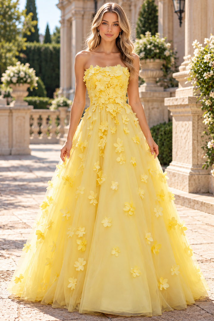 Make a stunning entrance in this yellow strapless A-line prom gown. The empire waist creates a flattering silhouette while delicate appliqués add elegant dimension to the bodice. Perfect for prom, formal events, or special occasions, this long gown delivers timeless sophistication with modern flair.